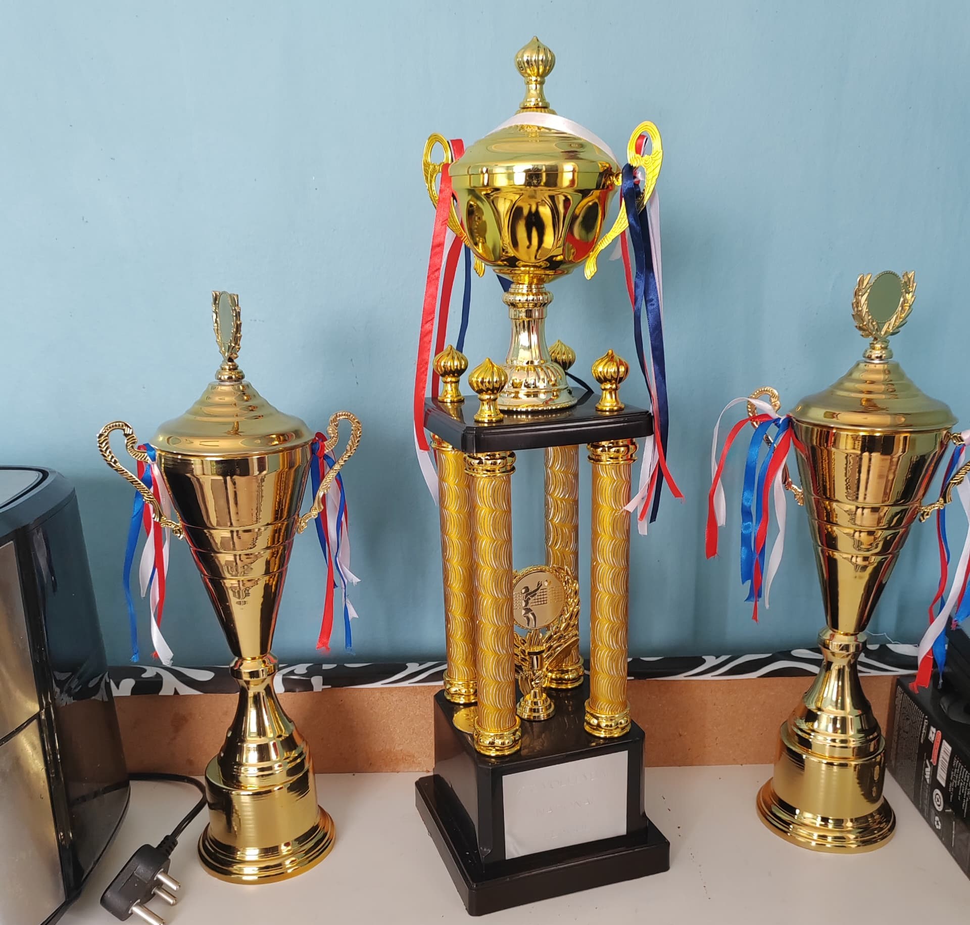 A collection of gold and silver sports trophies